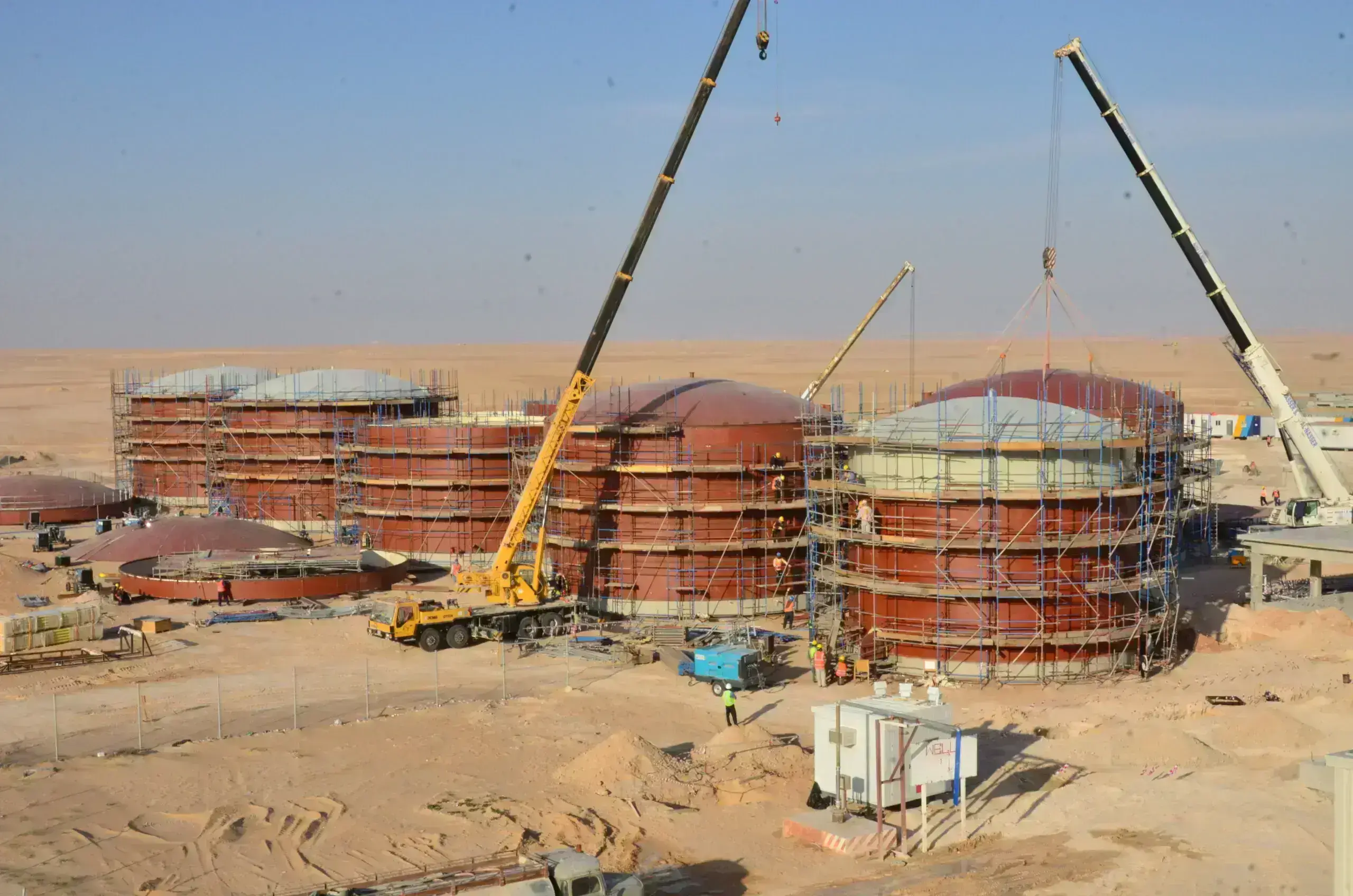 Workers preparing the tank surface for repair Surface Treatment for Tank Refurbishment Astha Tank Construction